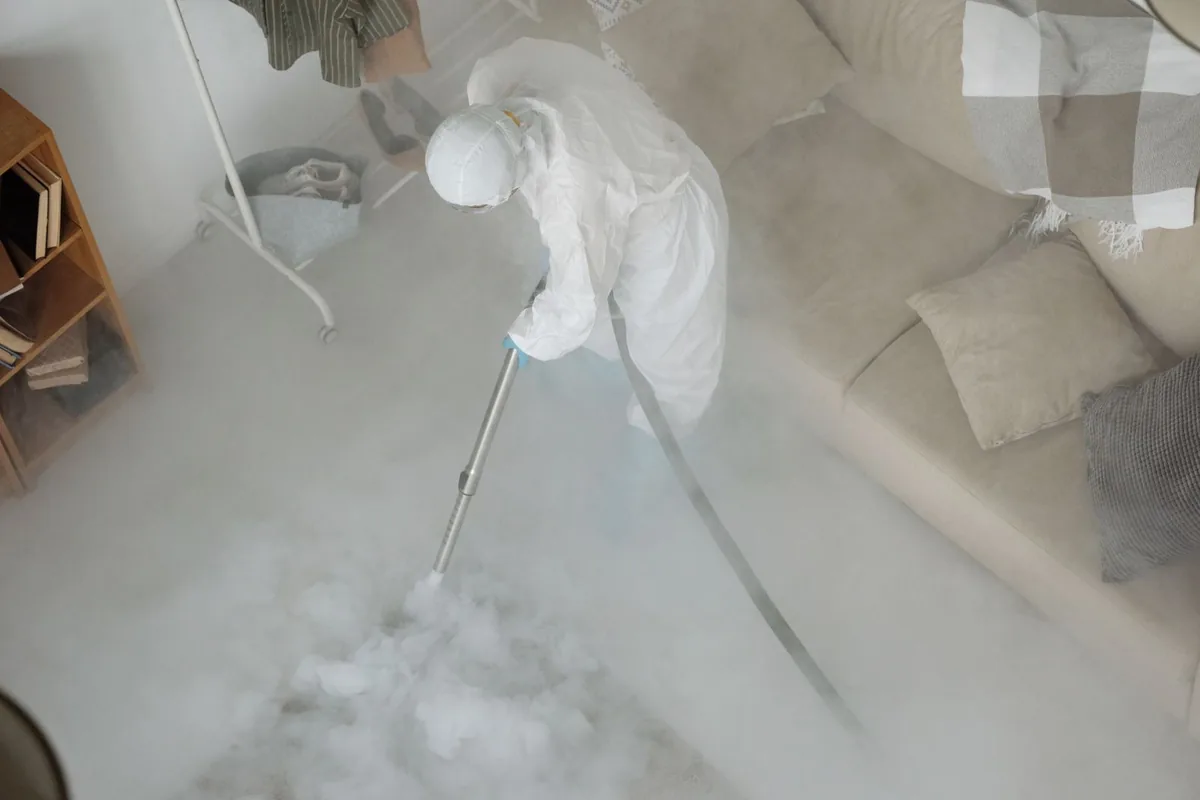Biohazard cleanup technician in protective equipment, Brewer's Hill, Milwaukee, WI